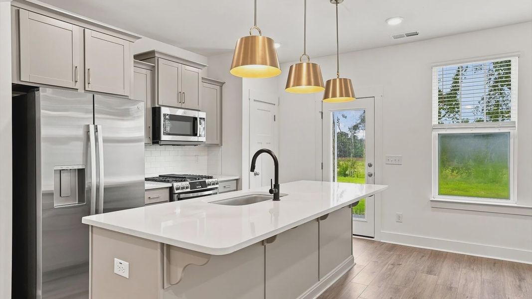 Accomplished layout with a first-class kitchen in this select villa community by DRB Homes