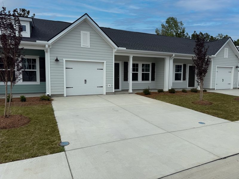 Front exterior of a new home in Blue Heron Retreat, Little River, SC, highlighting curb appeal (Image 2). Front exterior of a new home in Blue Heron Retreat, Little River, SC, highlighting curb appeal (Image 2).