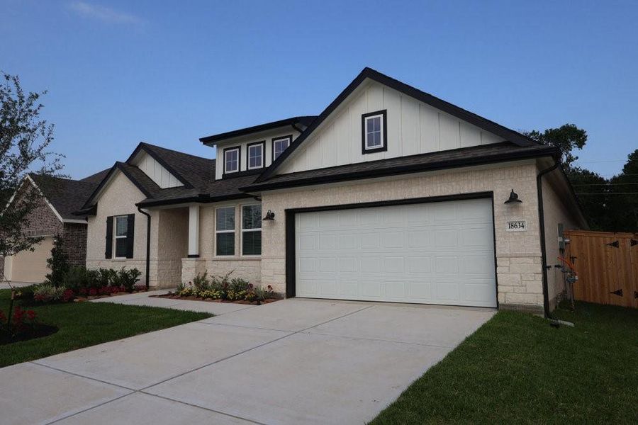 Front exterior of a new home in Sundance Cove, Crosby, TX, highlighting curb appeal (Image 19).
