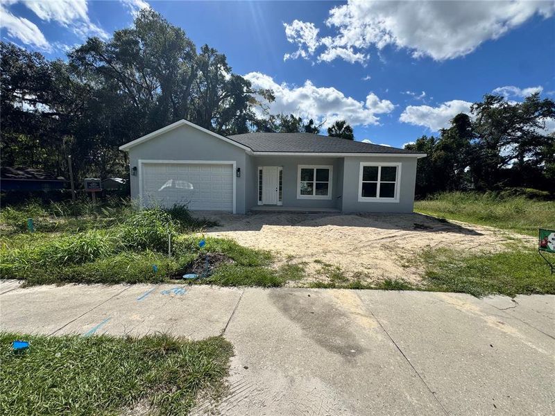 Front exterior of a new home in , Ocala, FL, highlighting curb appeal (Image 1). Front exterior of a new home in , Ocala, FL, highlighting curb appeal (Image 1).