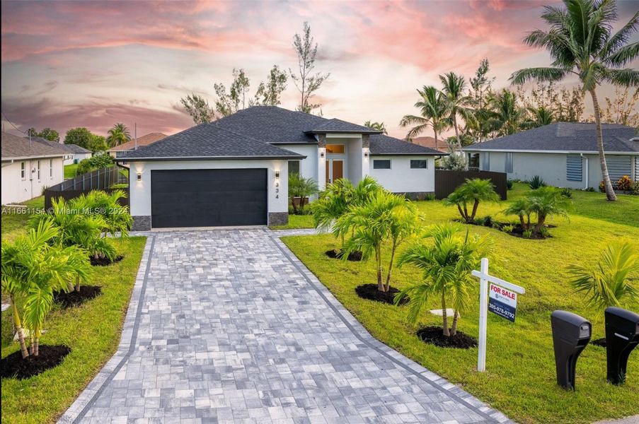Front exterior of a new home in , Cape Coral, FL, highlighting curb appeal (Image 22).