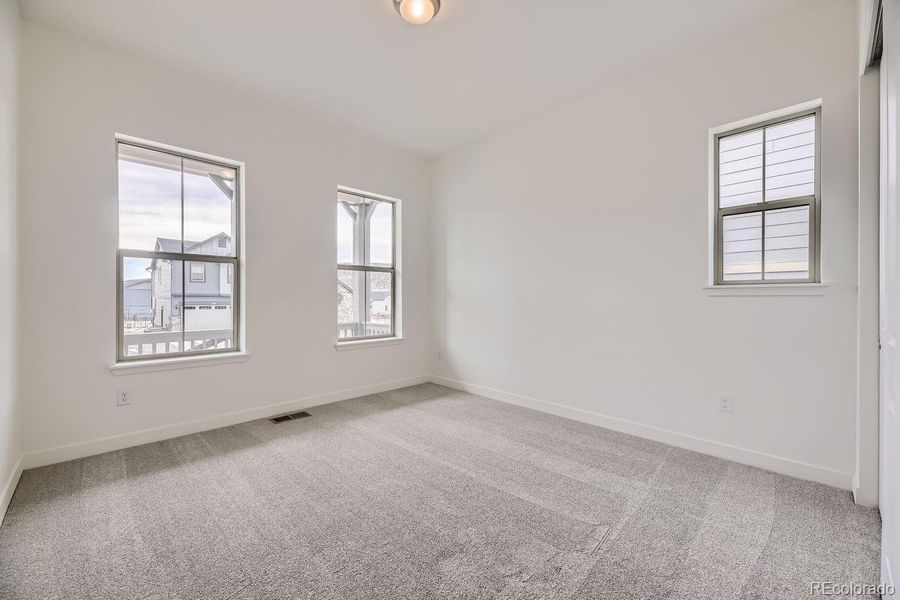 Spacious, unfurnished interior of a new home in Red Rocks Ranch: The Grand Collection, Morrison (Image 10).