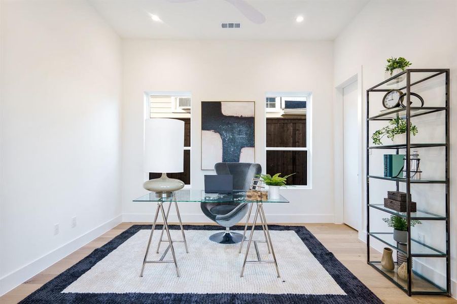 Office area featuring light hardwood / wood-style flooring