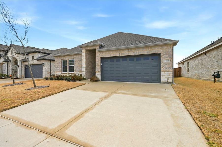 Front exterior of a new home in , Forney, TX, highlighting curb appeal (Image 19).