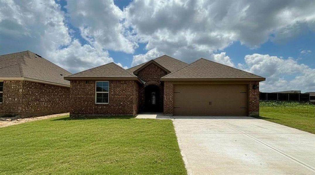 Brick exterior with an attached garage, featuring a concrete driveway, well-maintained lawn, and a covered entry Brick exterior with an attached garage, featuring a concrete driveway, well-maintained lawn, and a covered entry