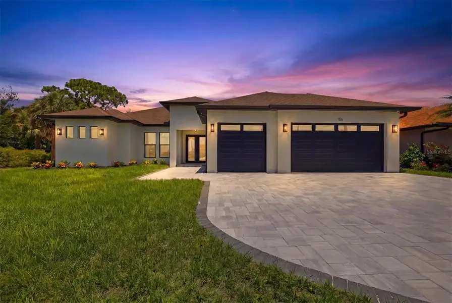 Front exterior of a new home in , Rotonda West, FL, highlighting curb appeal (Image 25).