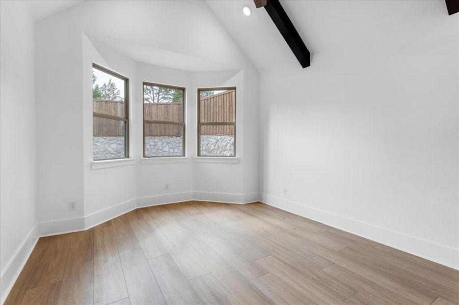 Spare room featuring light wood-type flooring and recessed lighting