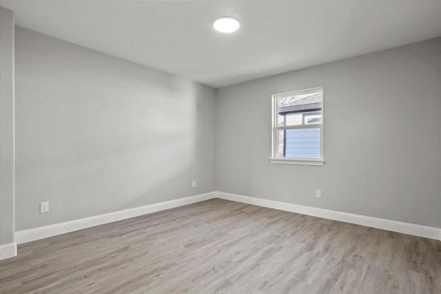 Unfurnished room with light hardwood / wood-style floors