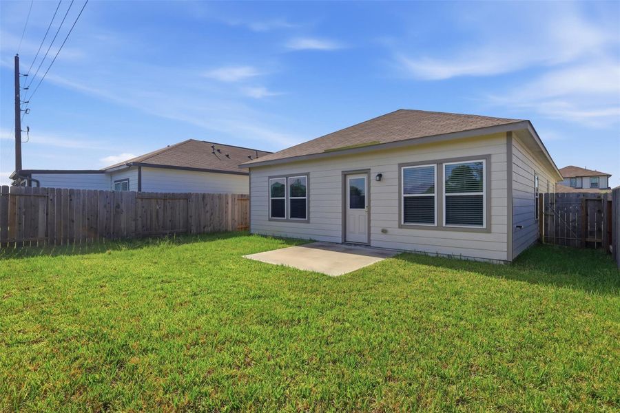 Exterior details and patio area of a home in Barrett Crossing, Crosby (Image 4).