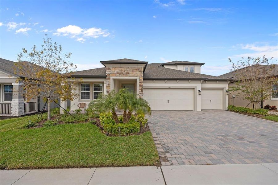 Front exterior of a new home in , Wesley Chapel, FL, highlighting curb appeal (Image 1). Front exterior of a new home in , Wesley Chapel, FL, highlighting curb appeal (Image 1).