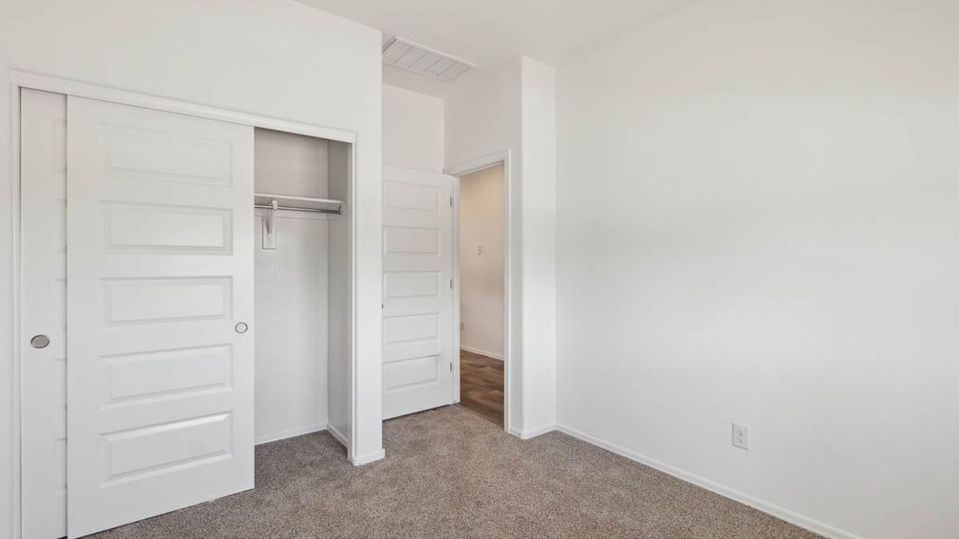 Representative unfurnished interior of a home built from the Puffin by D.R. Horton in Moonlight, Maricopa (Image 23).
