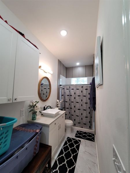 Comfortable bedroom featuring a cozy bed and ample storage solutions. Comfortable bedroom featuring a cozy bed and ample storage solutions.
