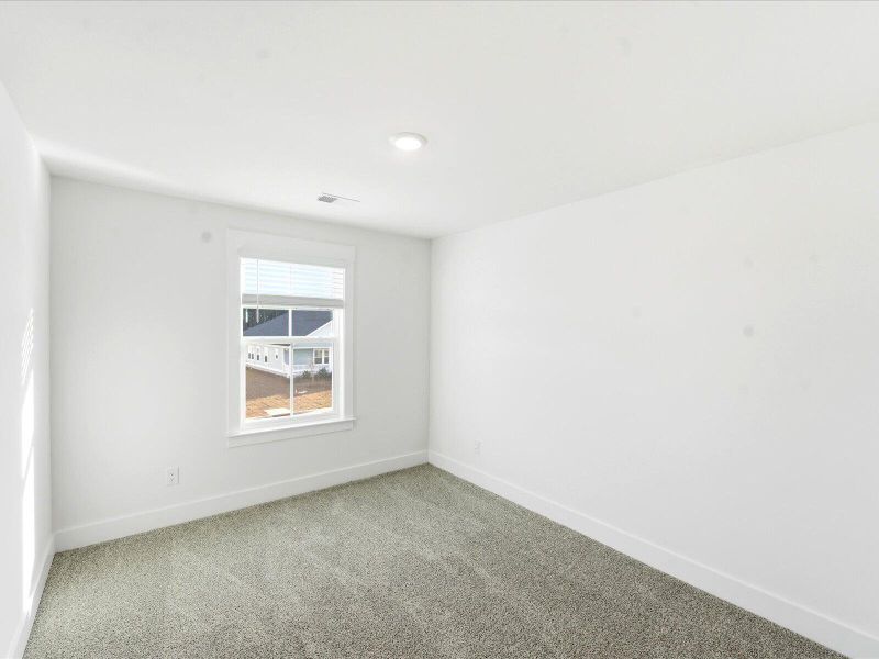 Spacious, unfurnished interior of a new home in The Coves at Lakes of Cane Bay II, Summerville (Image 35).