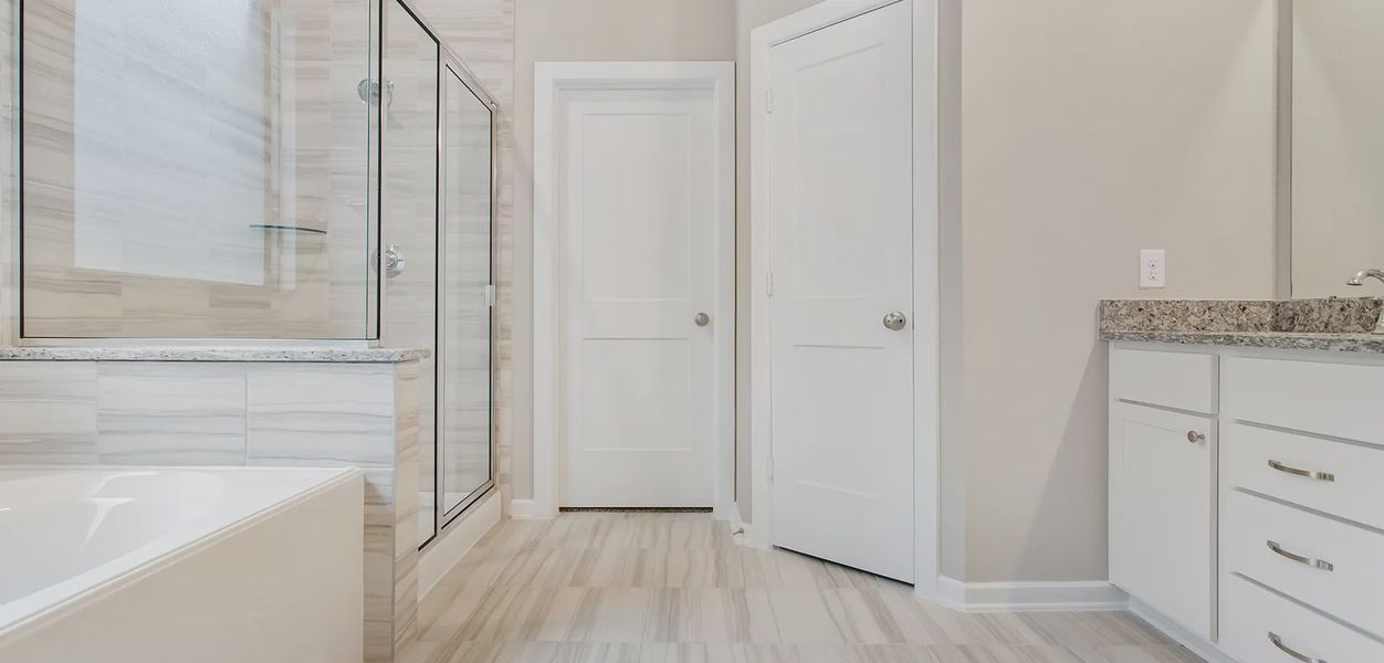 Representative furnished interior of a home built from the Sunnyside by Chesmar Homes in Wood Leaf Reserve, Tomball (Image 5).