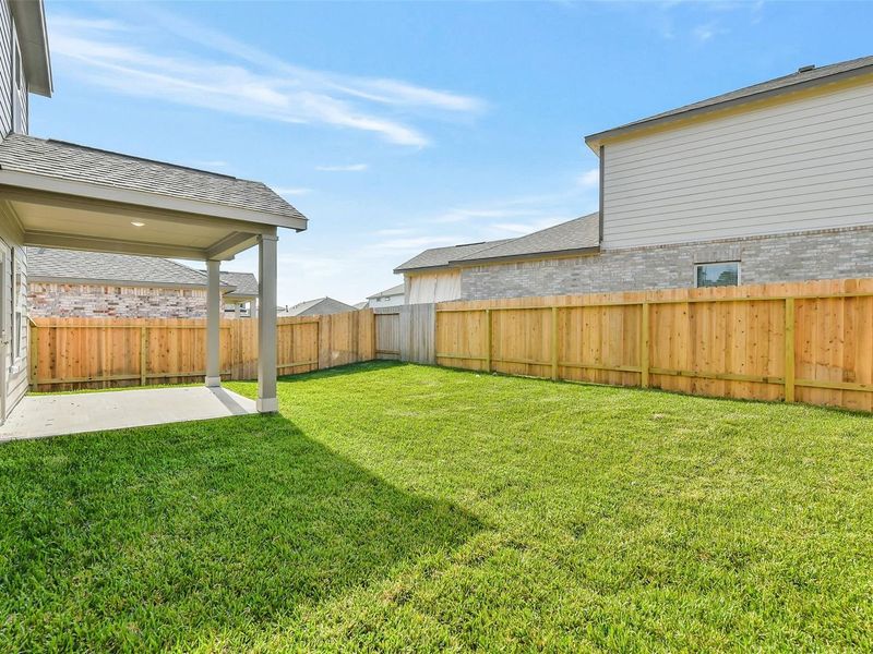Exterior details and patio area of a home in Lakes at Black Oak, Magnolia (Image 4).