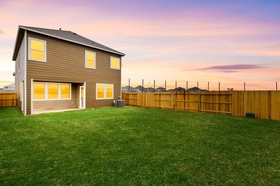 Fully fenced backyard with a cozy covered patio, just enough for outdoor activities Fully fenced backyard with a cozy covered patio, just enough for outdoor activities