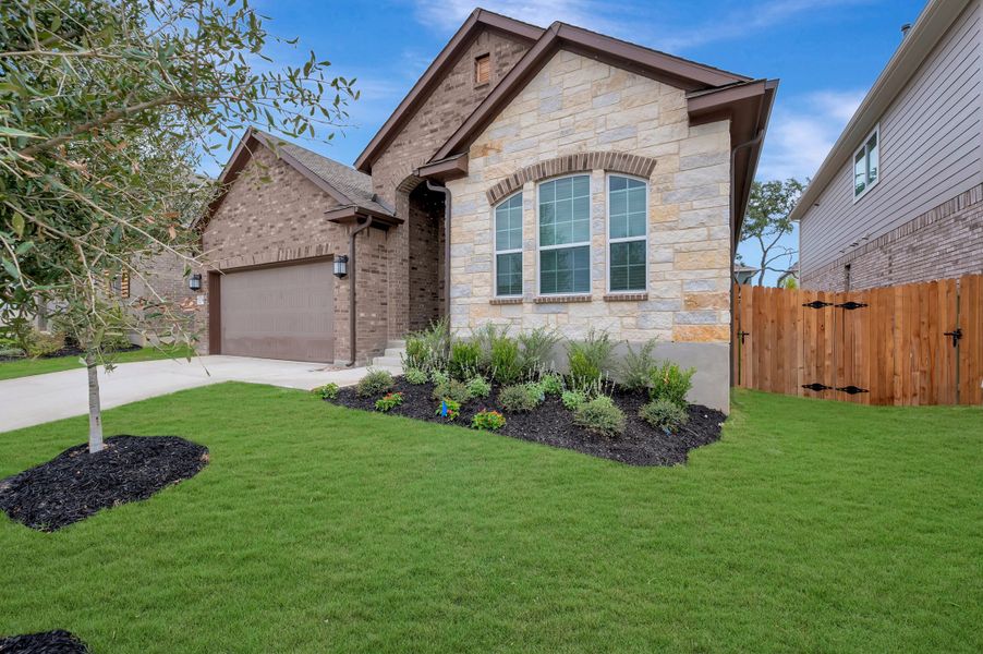 Front exterior of a new home in Davis Ranch 50', San Antonio, TX, highlighting curb appeal (Image 25). Front exterior of a new home in Davis Ranch 50', San Antonio, TX, highlighting curb appeal (Image 25).