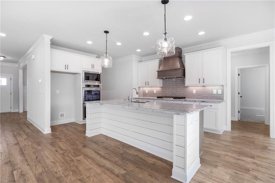Furnished interior view inside a new home in Calgary Downs, Winder (Image 2).