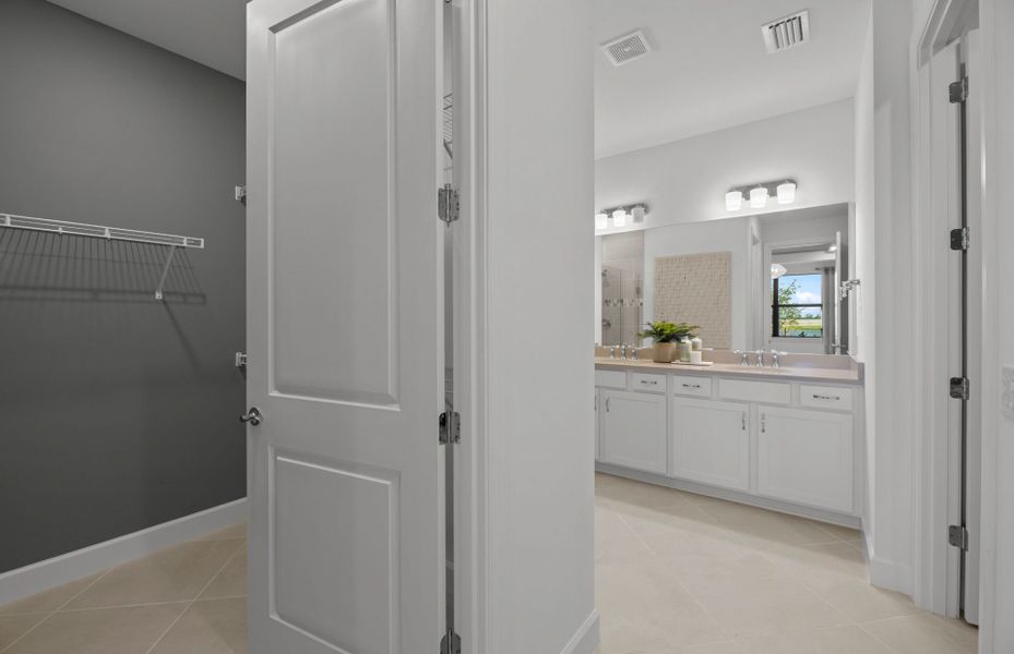 Luxurious owner's bathroom with dual sink vanity