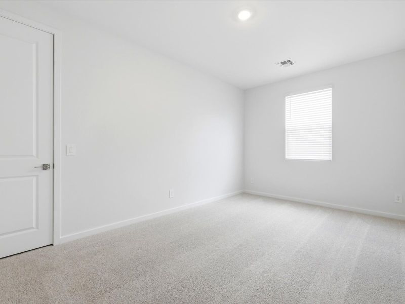 Spacious, unfurnished interior of a new home in White Tank Foothills Signature Series, Waddell (Image 17).