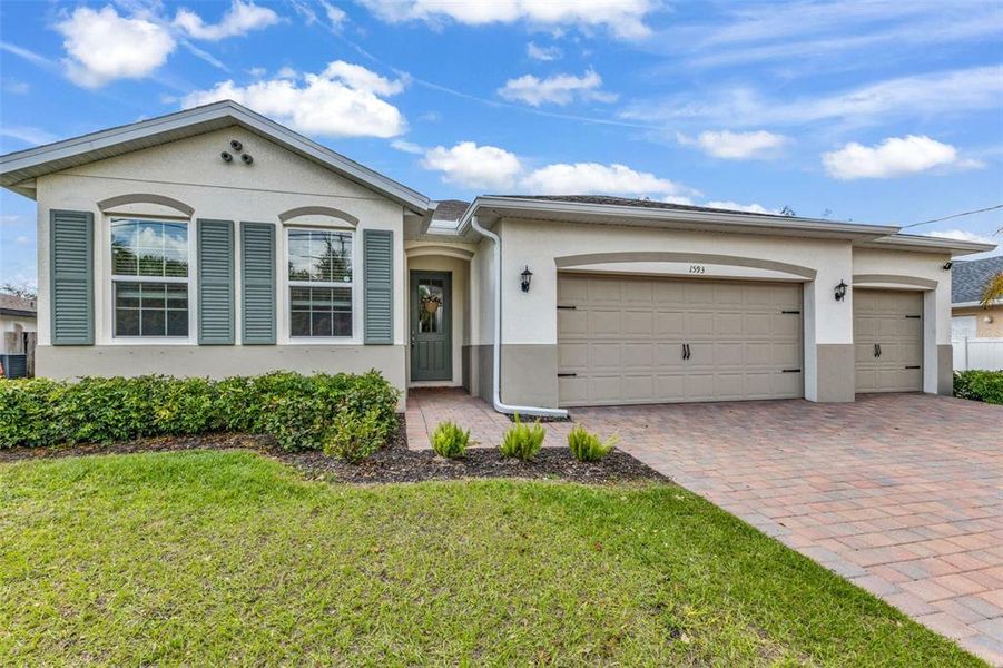 Front exterior of a new home in , North Port, FL, highlighting curb appeal (Image 25). Front exterior of a new home in , North Port, FL, highlighting curb appeal (Image 25).