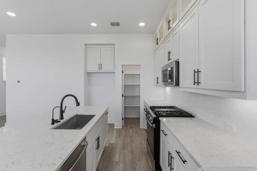 Furnished interior view inside a new home in Centero at Stone Oak, San Antonio (Image 11).