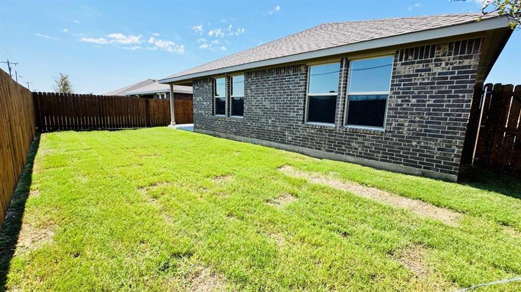 Front exterior of a new home in Meadowbrook Estates, Cleburne, TX, highlighting curb appeal (Image 1).