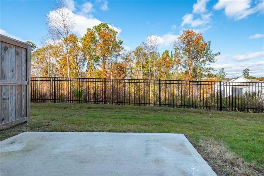 Exterior details and patio area of a home in Avignon - Townhomes, Cumming (Image 16). Exterior details and patio area of a home in Avignon - Townhomes, Cumming (Image 16).