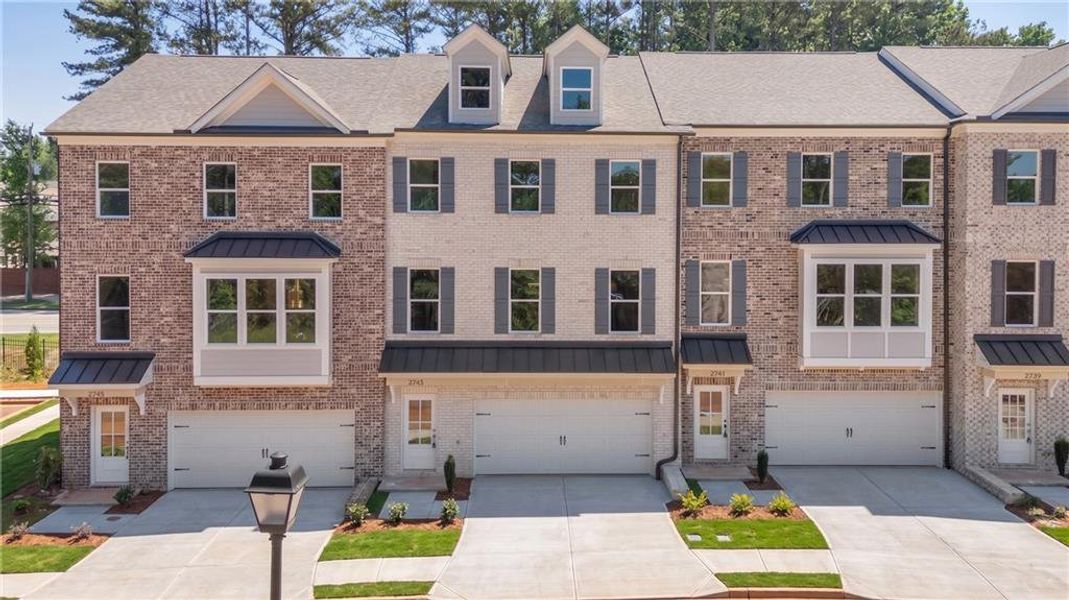Front exterior of a new home in , Suwanee, GA, highlighting curb appeal (Image 1). Front exterior of a new home in , Suwanee, GA, highlighting curb appeal (Image 1).