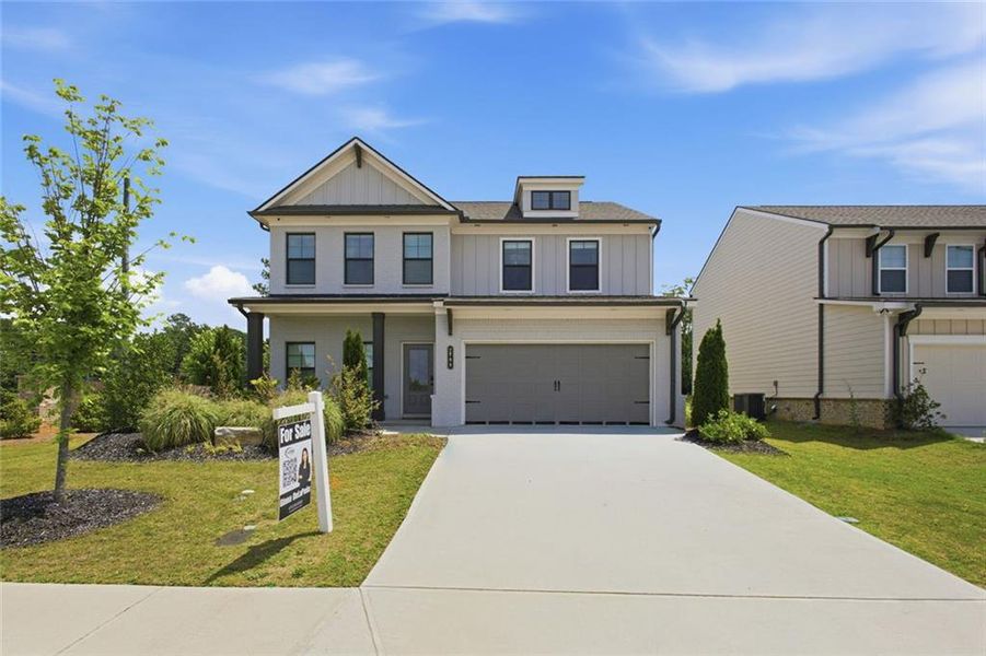 Front exterior of a new home in Westgate Estates, Loganville, GA, highlighting curb appeal (Image 2). Front exterior of a new home in Westgate Estates, Loganville, GA, highlighting curb appeal (Image 2).