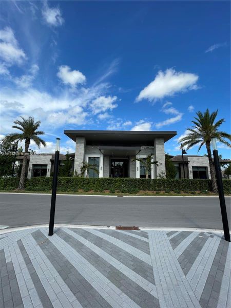 Front exterior of a new home in , Doral, FL, highlighting curb appeal (Image 1).