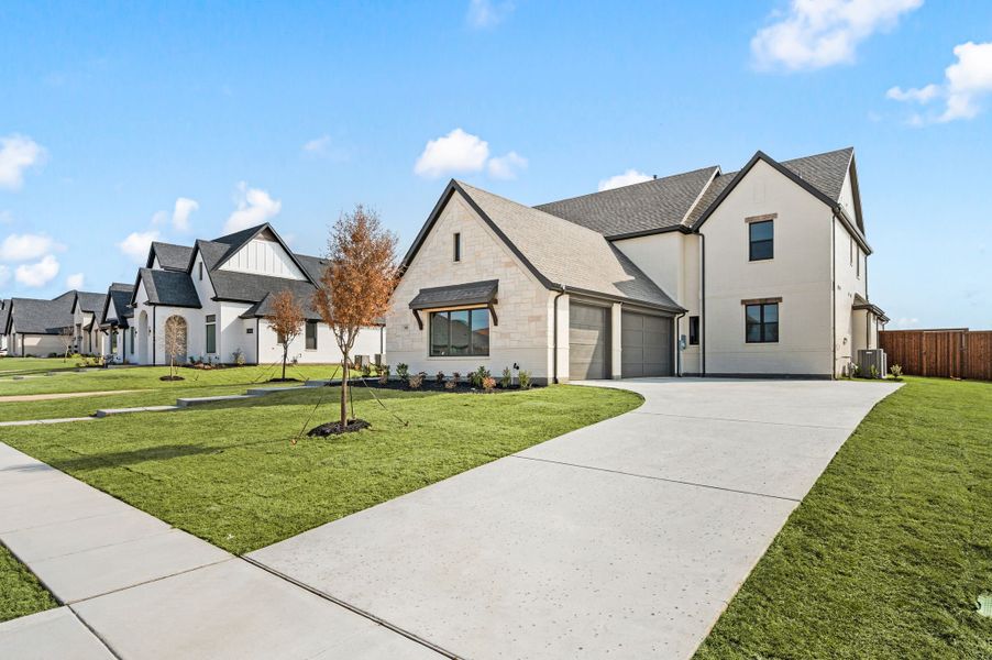 Front exterior of a new home in NorthGlen, Haslet, TX, highlighting curb appeal (Image 2). Front exterior of a new home in NorthGlen, Haslet, TX, highlighting curb appeal (Image 2).