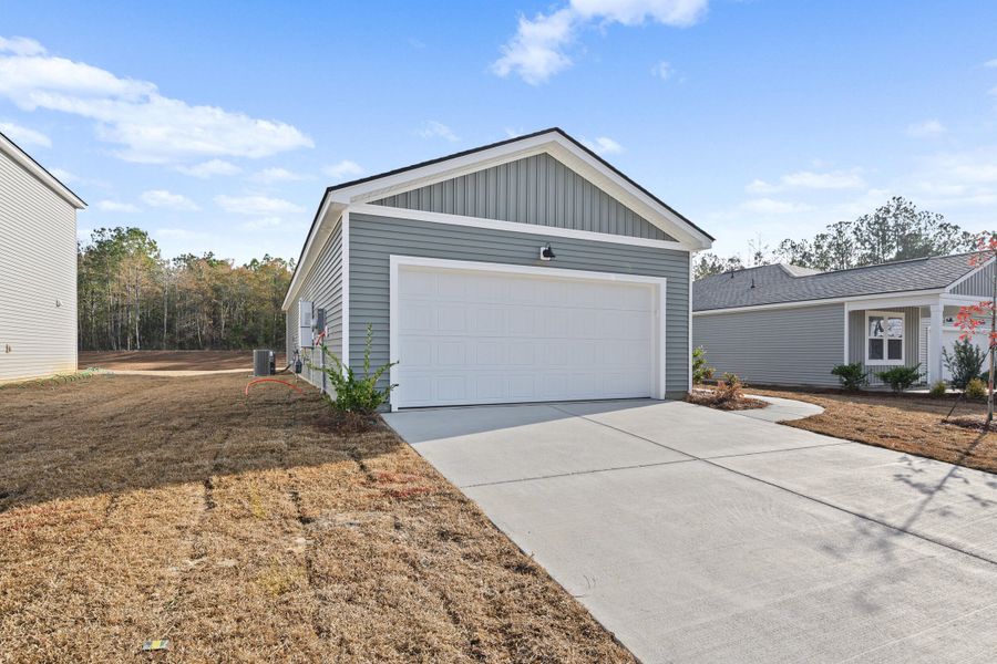 Front exterior of a new home in Bradford Pointe, Summerville, SC, highlighting curb appeal (Image 18).
