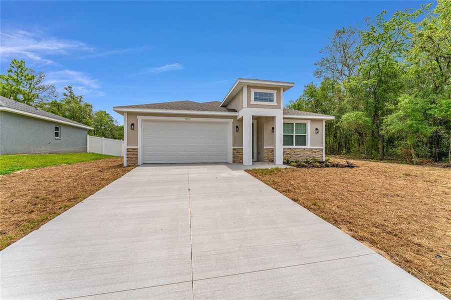 Front exterior of a new home in , Summerfield, FL, highlighting curb appeal (Image 1). Front exterior of a new home in , Summerfield, FL, highlighting curb appeal (Image 1).