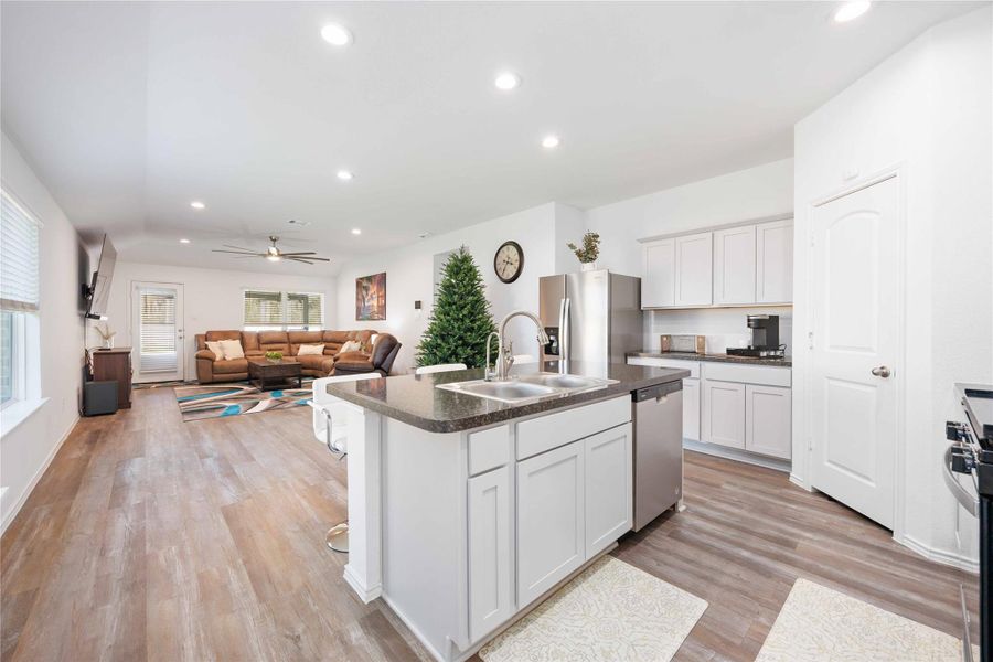 The open flow between living and kitchen spaces creates a welcoming atmosphere ideal for gathering, relaxing, or everyday routines, while the neutral palette allows the space to easily reflect your personal style. The open flow between living and kitchen spaces creates a welcoming atmosphere ideal for gathering, relaxing, or everyday routines, while the neutral palette allows the space to easily reflect your personal style.