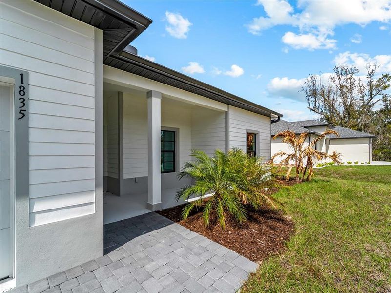 Exterior details and patio area of a home in , North Port (Image 35).