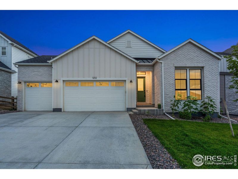 Front exterior of a new home in , Timnath, CO, highlighting curb appeal (Image 24).