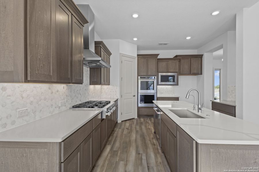 Furnished interior view inside a new home in Highland Estates, San Antonio (Image 13).