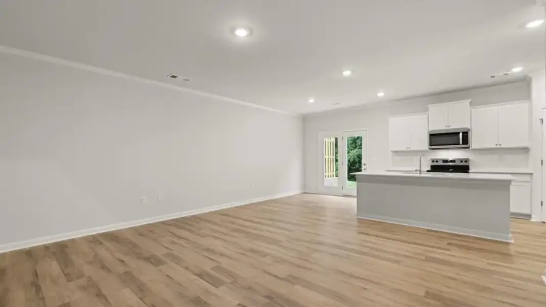 Spacious, unfurnished interior of a new home in Waypoint, Flowery Branch (Image 14).