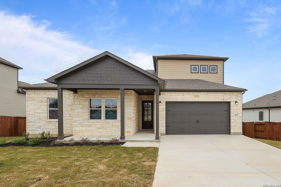 Front exterior of a new home in Homestead, Schertz, TX, highlighting curb appeal (Image 1). Front exterior of a new home in Homestead, Schertz, TX, highlighting curb appeal (Image 1).
