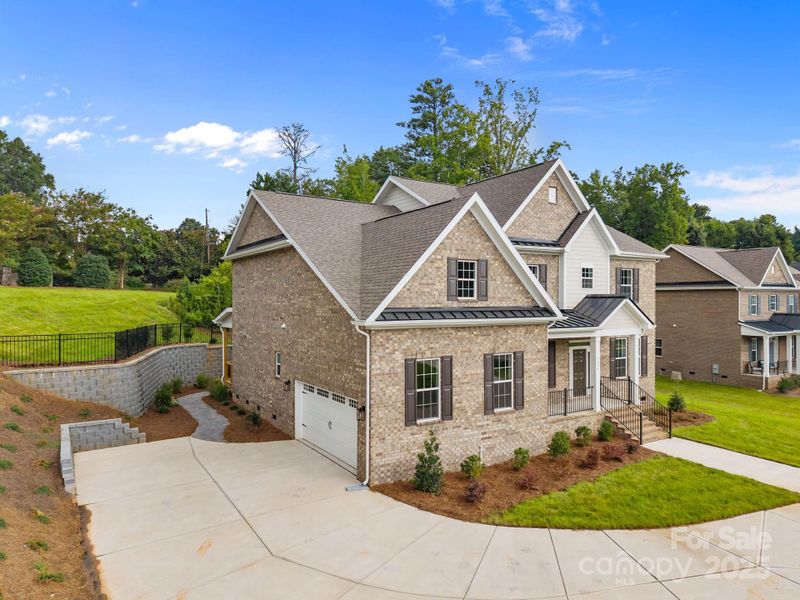 Front exterior of a new home in Stonebridge, Mint Hill, NC, highlighting curb appeal (Image 23). Front exterior of a new home in Stonebridge, Mint Hill, NC, highlighting curb appeal (Image 23).