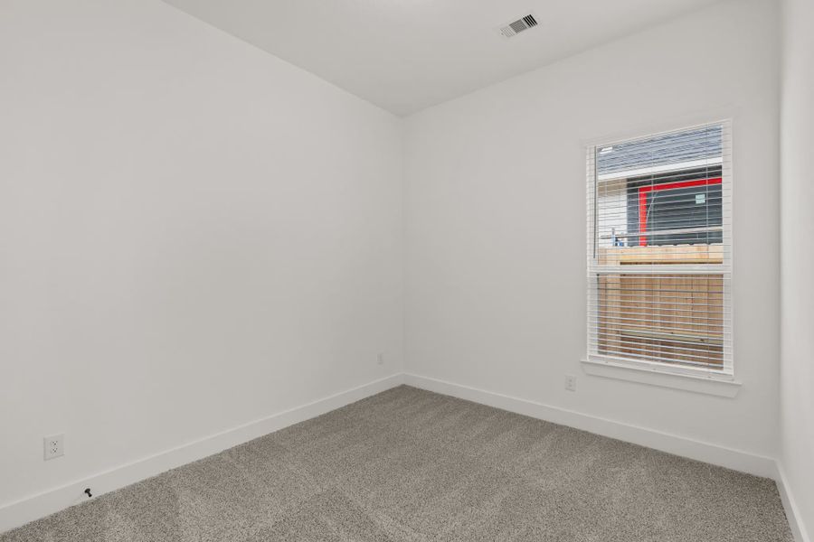 Representative unfurnished interior of a home built from the Pinehurst by Chesmar Homes in Riceland Alley Loads, Mont Belvieu (Image 16).