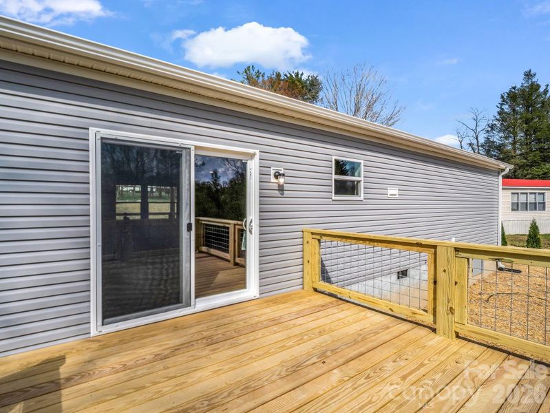 Exterior details and patio area of a home in , East Flat Rock (Image 24).