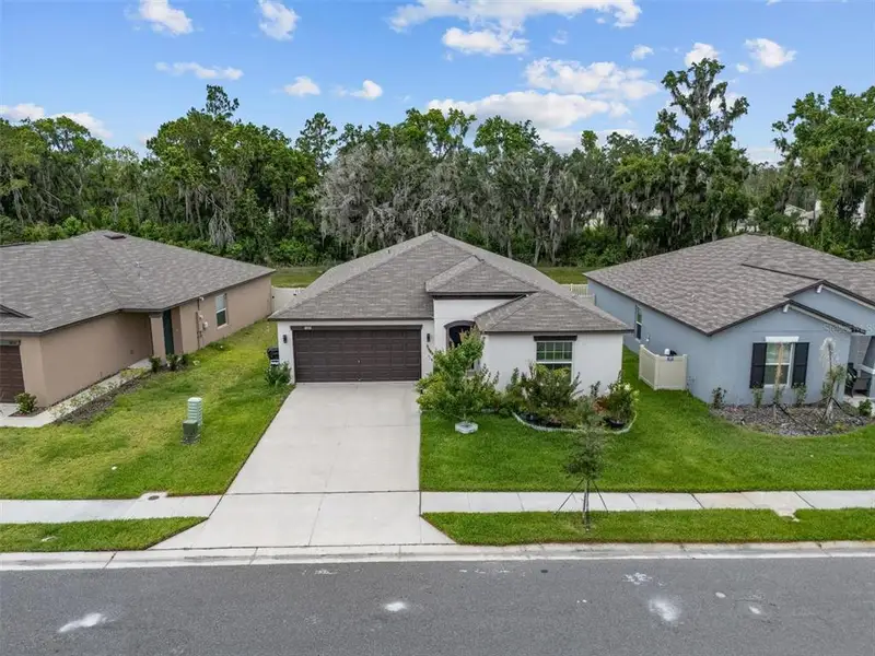 Front exterior of a new home in , Lakeland, FL, highlighting curb appeal (Image 1). Front exterior of a new home in , Lakeland, FL, highlighting curb appeal (Image 1).