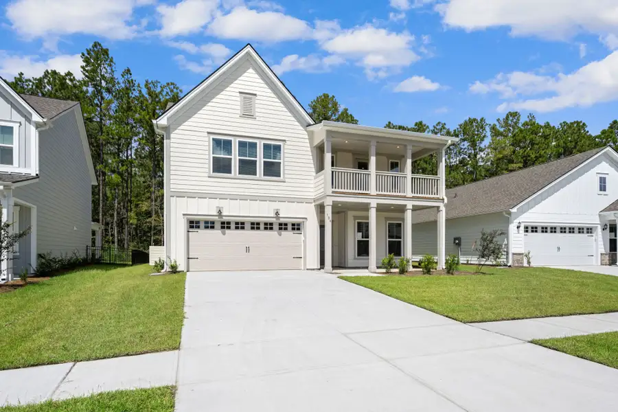 Front exterior of a new home in Waterways, Richmond Hill, GA, highlighting curb appeal (Image 26).