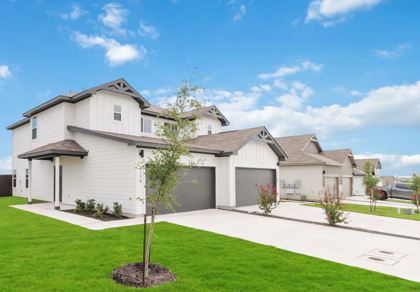 Representative exterior photo of a completed home built from the Duplex 5736 by TwoTen Communities in Emma Park, Buda, TX (Image 2). Representative exterior photo of a completed home built from the Duplex 5736 by TwoTen Communities in Emma Park, Buda, TX (Image 2).