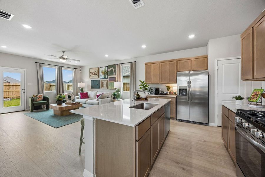 Kitchen in the Oak home plan by Trophy Signature Homes – REPRESENTATIVE PHOTO