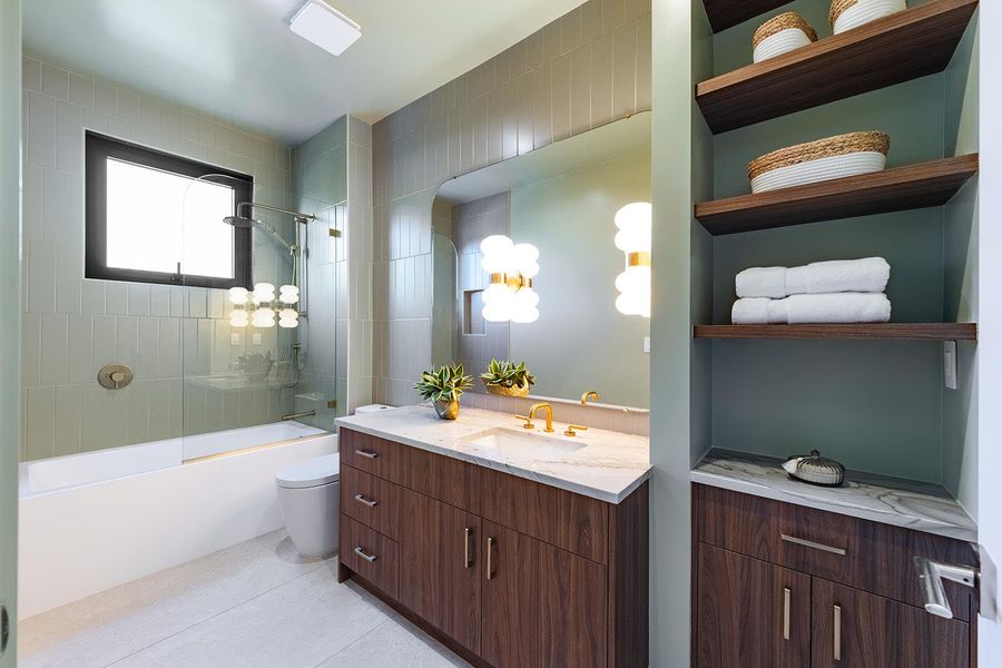 Upstairs baths soothe with serene hues. Upstairs baths soothe with serene hues.
