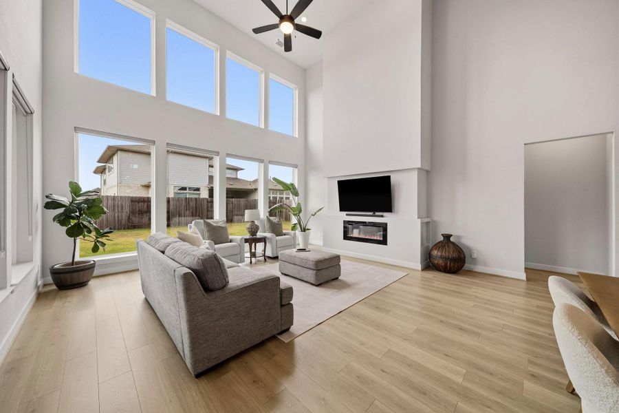 A striking linear gas fireplace serves as a luxurious architectural centerpiece, casting a warm, ambient glow that elevates the room with refined sophistication, perfect for relaxing evenings at home or elegant entertaining.