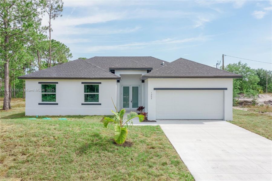 Front exterior of a new home in , Lehigh Acres, FL, highlighting curb appeal (Image 16).